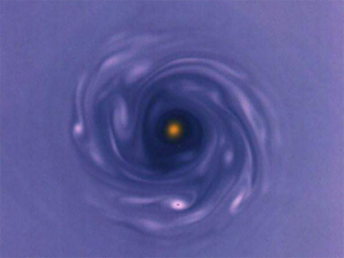 Numerical simulation of anticyclonic vortices in a simplified model of a protoplanetary disk. The plot shows fluid vorticity